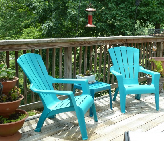 teal chairs with plants